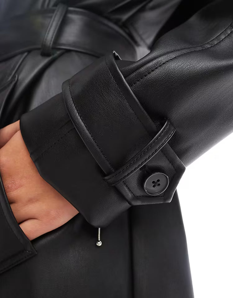 Black faux leather trench coat with belt